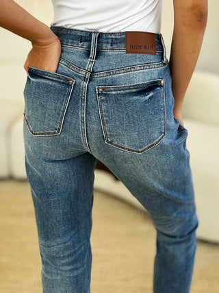 Close-up of Judy Blue 88818 jeans showing the rear pockets and branded waistband patch.