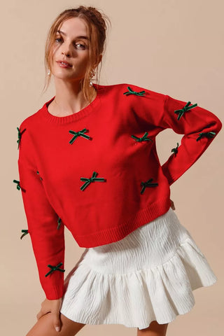 SO ME red ribbon-bow sweater showing hunter-green bows across the front and sleeves.