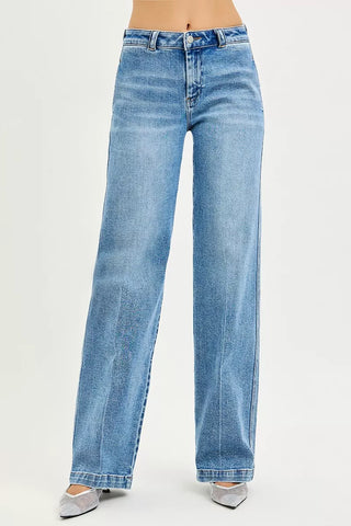 RISEN medium-wash straight jeans showing the button waist, front pockets and relaxed legs.