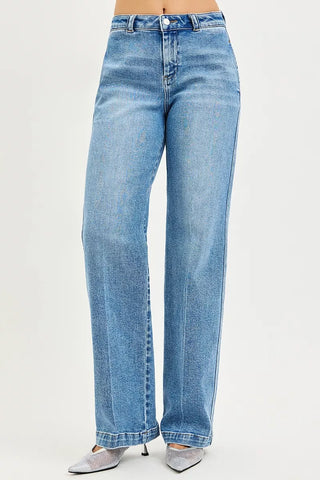 Angled front view of RISEN slouchy straight jeans in medium blue denim.