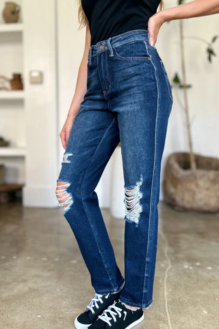 Side-front view of Judy Blue 88819 jeans showing heavy knee distressing and straight legs.