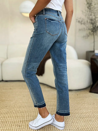Rear three-quarter view of Judy Blue 88818 release-hem jeans showing the back pockets.
