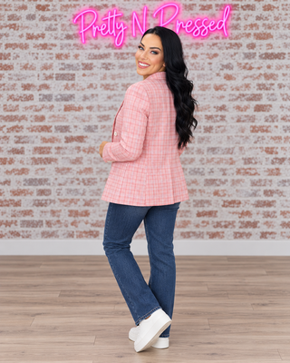 Natalie modeling the Get To It pink plaid double-breasted blazer, back view