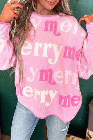 Pink Merry Me sweater front detail showing the round neckline, lettering and ribbed cuffs.