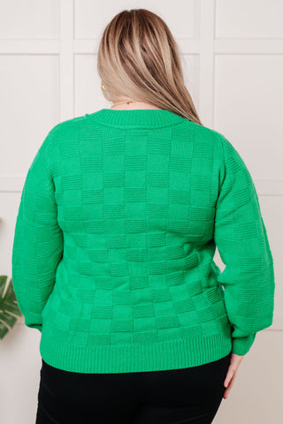 Green Jodifl A Song to Sing checkered-knit pullover, back view showing ribbed hem and cuffs.