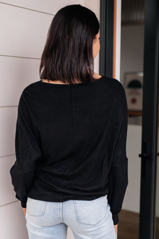 Black Very J Drive Downtown dolman-sleeve top, back view with light jeans.