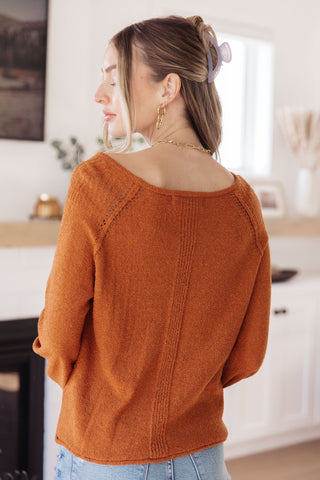 Rust Don't Be Difficult raglan pullover sweater, back view showing the center seam.