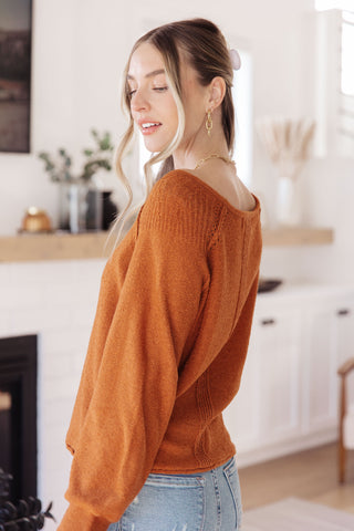 Rust Don't Be Difficult raglan pullover sweater, side view showing the long sleeve.