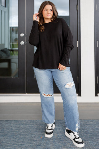 Black Very J Drive Downtown dolman-sleeve top, full outfit with distressed jeans and sneakers.