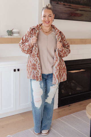 Taupe Sew In Love Less Conversation V-neck top, layered under a patterned jacket.
