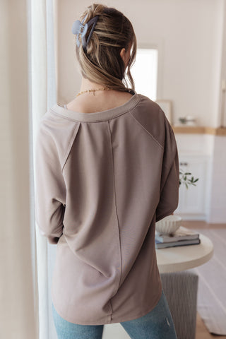 Taupe Sew In Love Less Conversation V-neck top, back view showing the center seam.