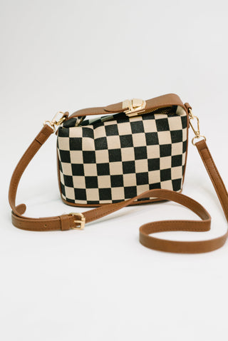 Zenana Send a Check canvas crossbody bag, black-and-cream checkerboard bag with tan strap.