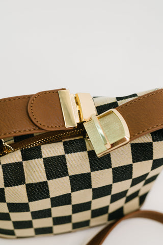 Zenana Send a Check canvas crossbody bag, close-up of the gold-tone buckle clip and zipper.