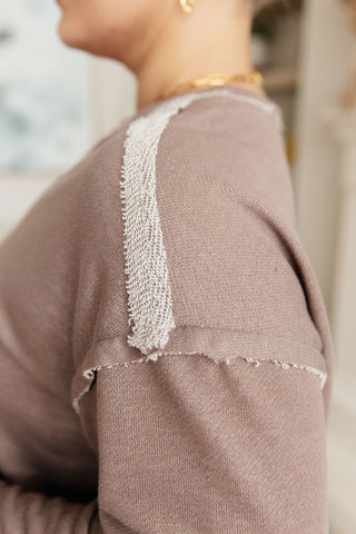 Taupe Sew In Love Spring In My Step V-neck pullover, close-up of the exposed shoulder seam.