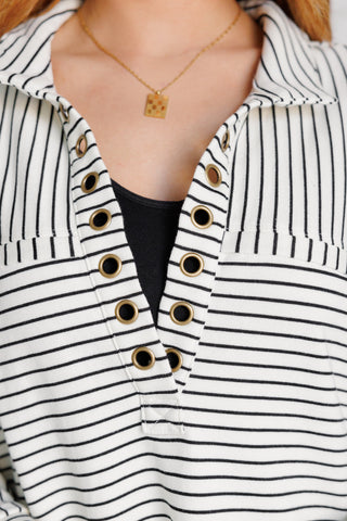 BiBi Striped Serendipity collared pullover, close-up of the collared V-neck and grommets.
