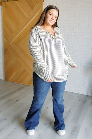 BiBi Striped Serendipity collared pullover, full outfit with wide-leg jeans.