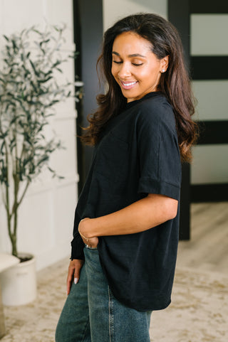 Black Dear Scarlett Layback relaxed tee, side view showing the dolman sleeve.