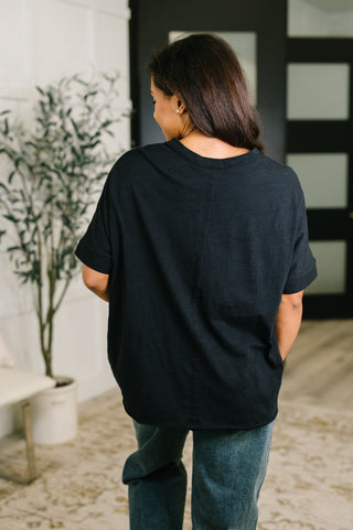 Black Dear Scarlett Layback relaxed tee, back view showing the relaxed shape.