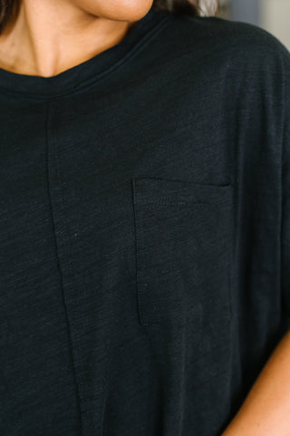 Black Dear Scarlett Layback relaxed tee, close-up of the round neckline and knit texture.