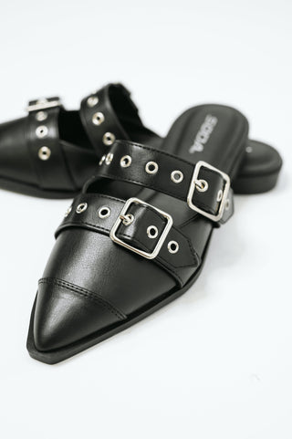 Black Soda Usual pointed-toe double-buckle flats, close-up of pointed toes and silver buckles.