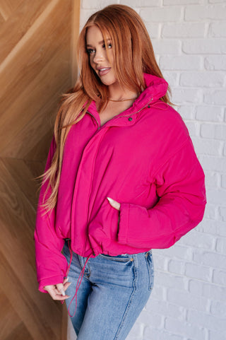 Bright-pink White Birch Warm Regards puffer jacket, side-front view showing a pocket.