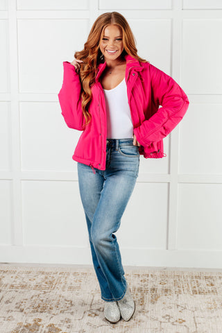 Bright-pink White Birch Warm Regards puffer jacket, full outfit with blue jeans.