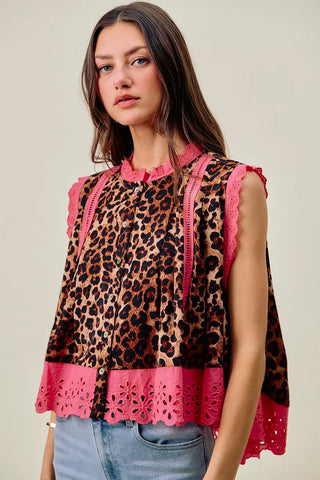 Front view of the SO ME leopard sleeveless blouse with contrasting pink neckline and hem trim.