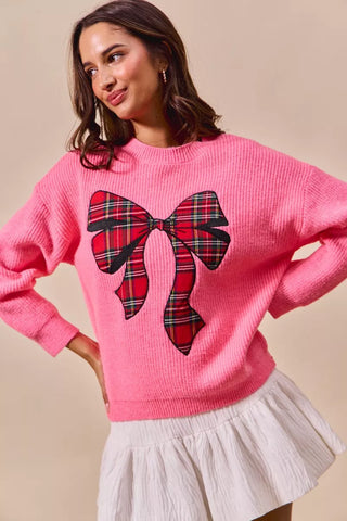 SO ME pink plaid-bow sweater showing the dropped shoulders and ribbed cuffs.