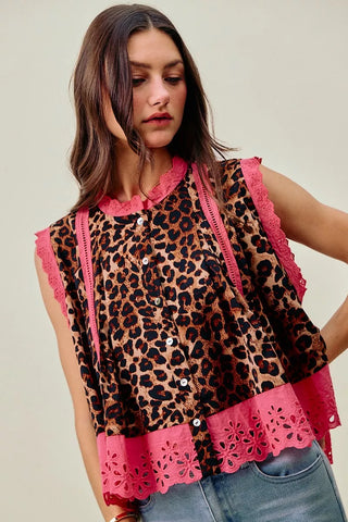 SO ME leopard-print blouse front view with bright pink trim, worn with jeans.