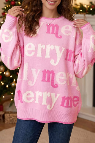 Front view of the pink Merry Me knit sweater with repeating cream and darker-pink merry lettering.