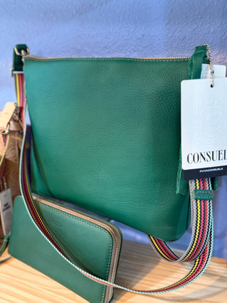 Consuela teal crossbody bag and matching zip wallet shown together; each sold separately