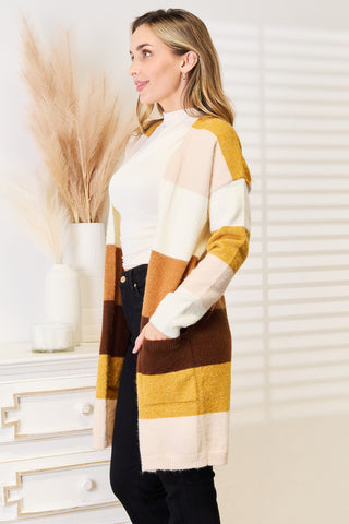 Side view of the Woven Right open-front color-block cardigan with a patch pocket.
