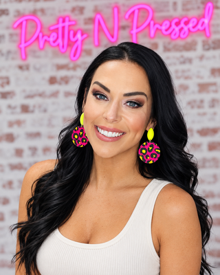 Natalie modeling Malibu Leopard Earrings at Pretty N Pressed Boutique