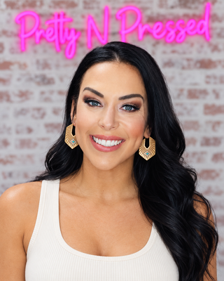 Natalie modeling Sunrise Hoop Earrings at Pretty N Pressed Boutique