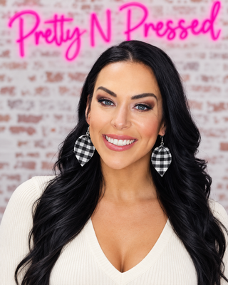Natalie modeling Tucked In Earrings at Pretty N Pressed Boutique