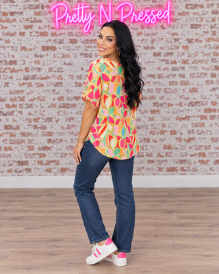 Natalie modeling the back of the Casual Chic Multicolor Abstract Top