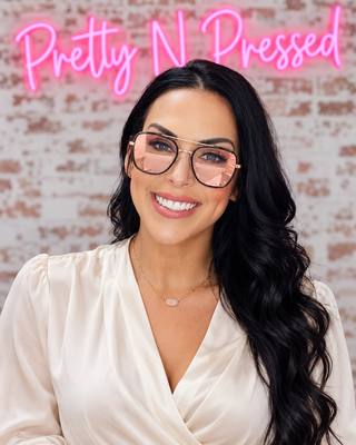 Natalie wearing Cove Rose Pink Sunglasses at Pretty N Pressed Boutique