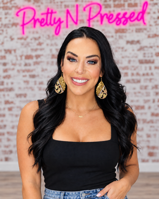 Natalie modeling Dakota Leopard Earrings at Pretty N Pressed Boutique