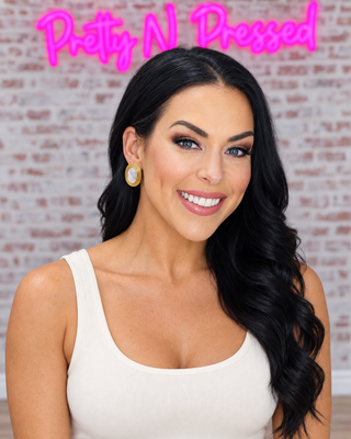 Natalie modeling HANNAH EARRINGS.