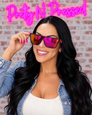 Natalie wearing Maverick sunglasses in the mirrored pink-orange variant