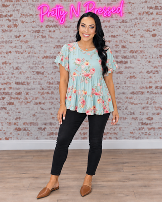 Natalie modeling In the Mint Meadows Tiered Babydoll Top, front-facing fall outfit with black denim.