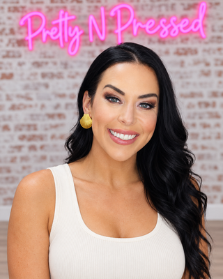 Natalie modeling Shell Earrings at Pretty N Pressed Boutique