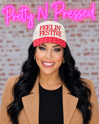 Natalie wearing Feelin’ Festive Bow Hat with a naturally snug cap fit