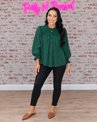 Natalie modeling Wildwood Check Green Smock, front-facing fall outfit with black denim.